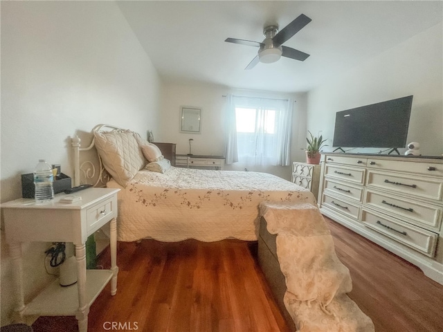 bedroom featuring ceiling fan and dark hardwood / wood-style flooring