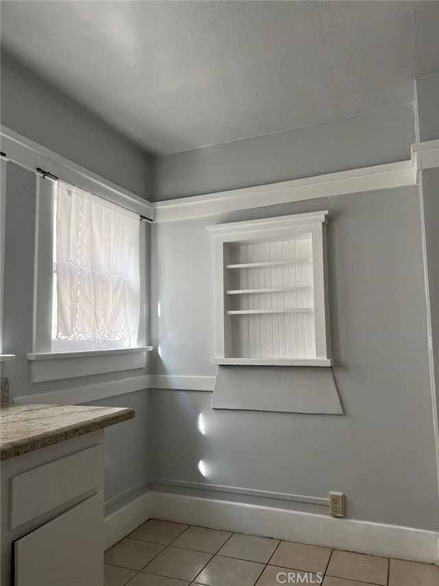 interior space featuring light tile patterned flooring