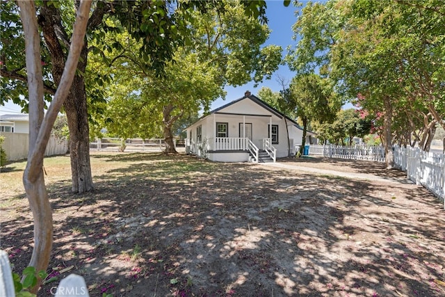 view of yard with covered porch