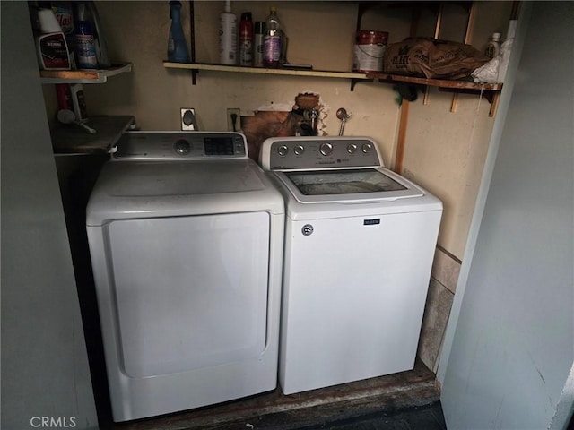 washroom with washer and dryer