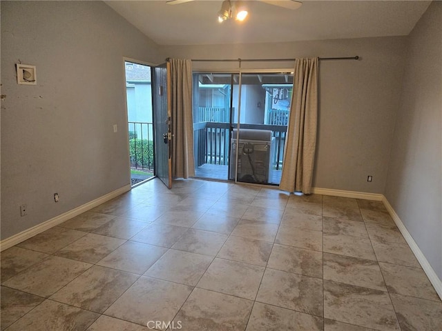 empty room featuring ceiling fan and lofted ceiling