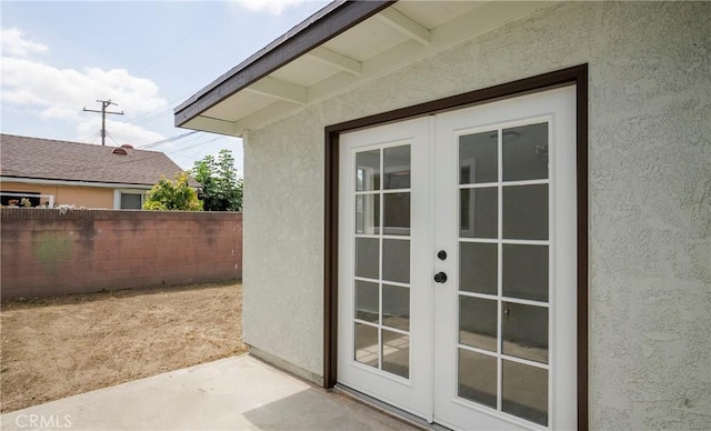 property entrance featuring french doors