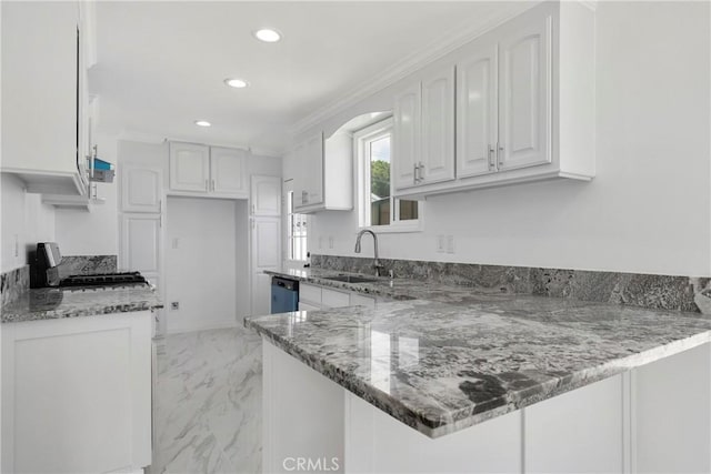 kitchen featuring dishwasher, dark stone countertops, kitchen peninsula, sink, and white cabinets