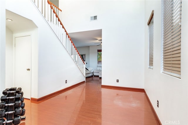 interior space featuring hardwood / wood-style floors and ceiling fan