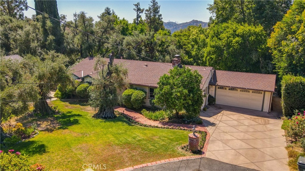 birds eye view of property with a mountain view