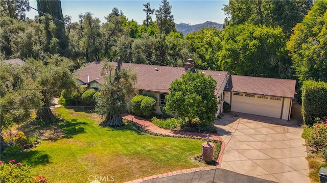 birds eye view of property with a mountain view