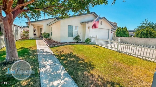 view of front of house featuring a front yard and a garage