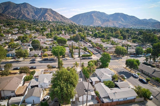 birds eye view of property with a mountain view