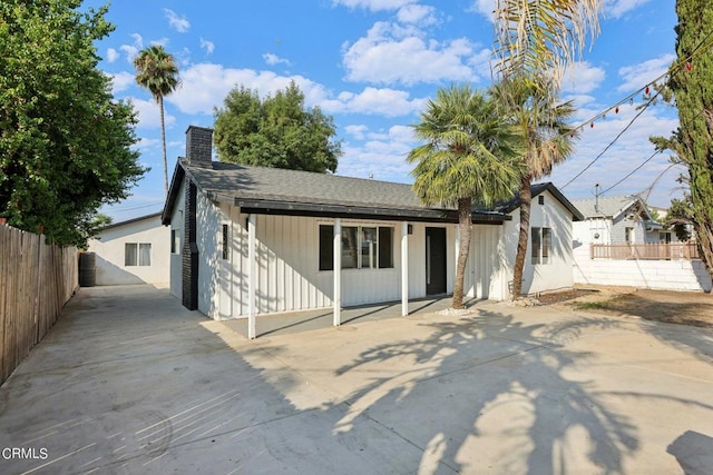 rear view of house featuring a patio