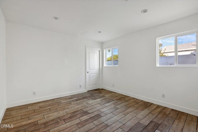 spare room featuring light hardwood / wood-style floors