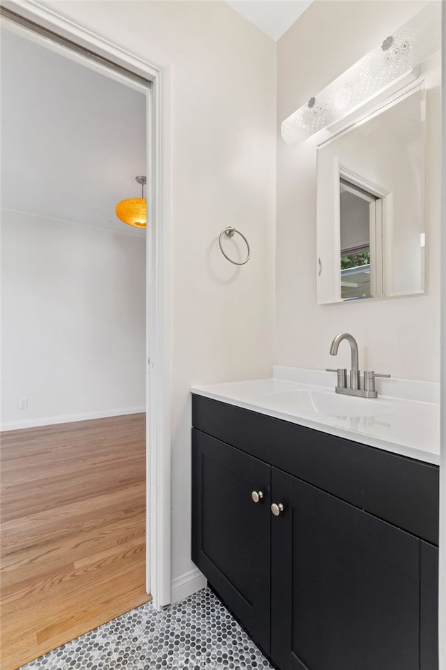 bathroom with vanity and hardwood / wood-style flooring