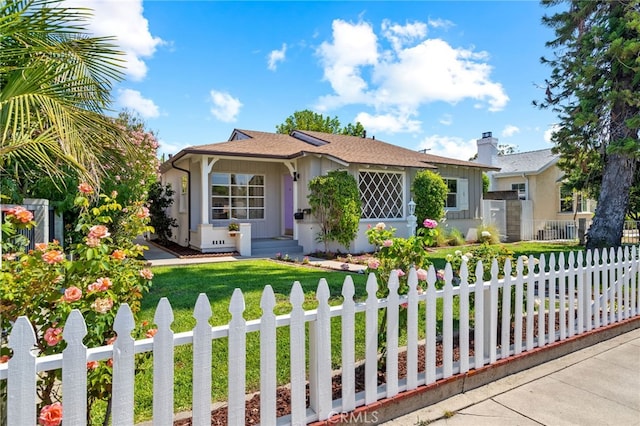 view of front of home with a front lawn