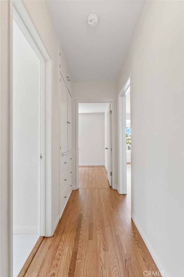 corridor featuring light hardwood / wood-style floors