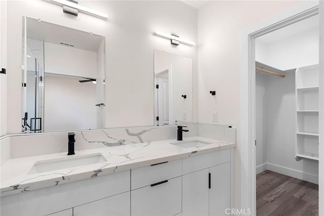 bathroom featuring vanity and wood-type flooring