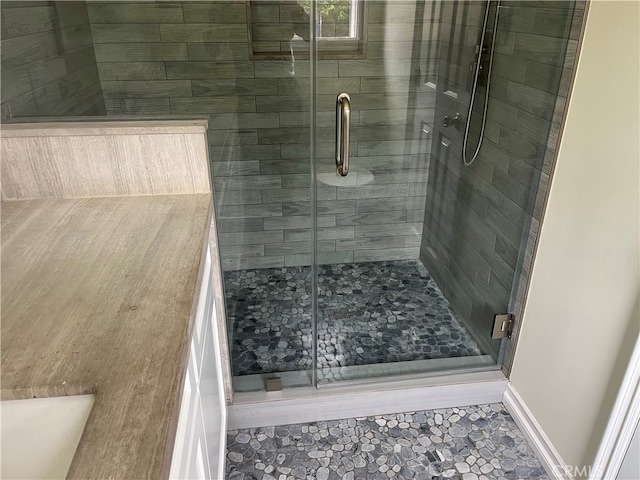 bathroom featuring an enclosed shower