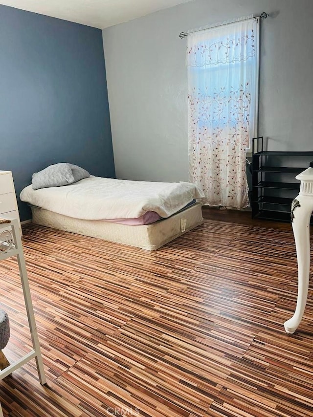 bedroom featuring hardwood / wood-style flooring