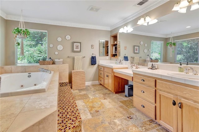 full bathroom featuring plenty of natural light, a whirlpool tub, vanity, and crown molding