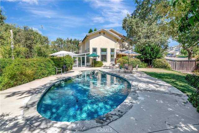 view of pool with a patio, fence, and a fenced in pool