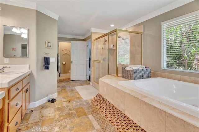 full bathroom with baseboards, stone tile flooring, ornamental molding, a shower stall, and a garden tub