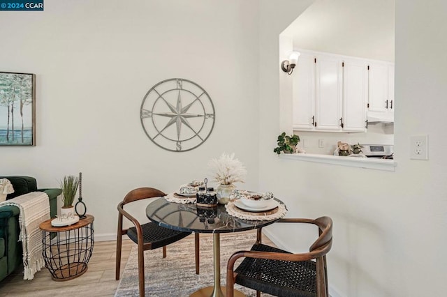 dining space featuring light hardwood / wood-style flooring