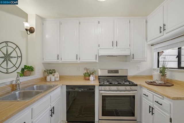 kitchen featuring stainless steel gas range oven, sink, white cabinetry, and black dishwasher