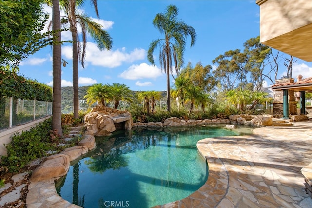 view of swimming pool with a patio area