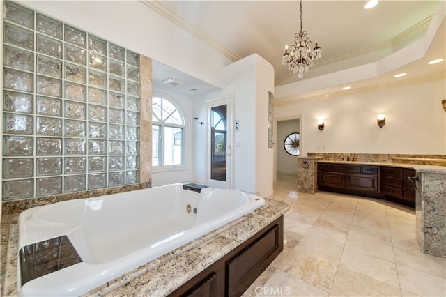 bathroom with crown molding, a bathing tub, and vanity