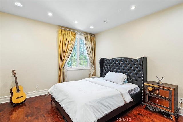 bedroom with dark wood-type flooring