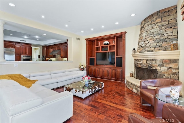 11755 Collar Ave, Tustin, CA 92782 - living area featuring dark wood-style floors, recessed lighting, and a stone fireplace