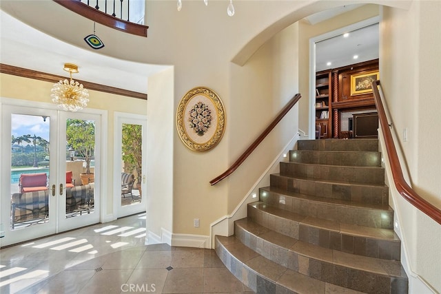11755 Collar Ave, Tustin, CA 92782 - tiled entryway featuring french doors, stairs, and a chandelier