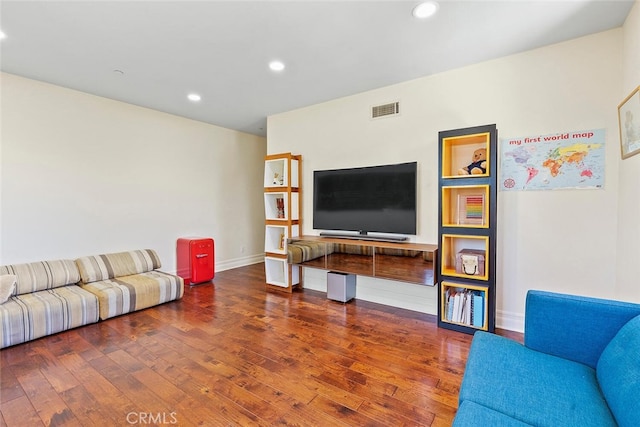 living room with dark hardwood / wood-style flooring