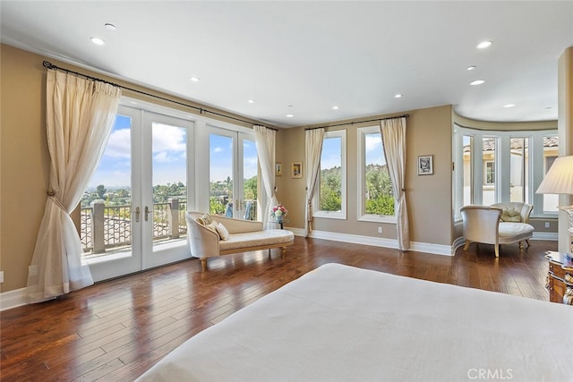 bedroom featuring dark wood-type flooring, access to exterior, and french doors