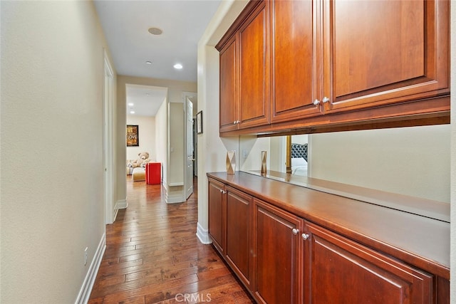 hallway with dark wood-type flooring