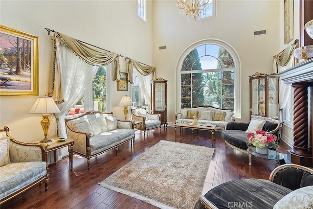 living room featuring dark hardwood / wood-style floors and a notable chandelier