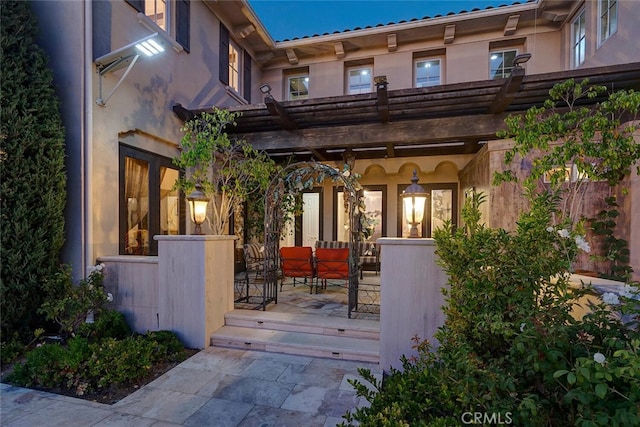 exterior space featuring a deck and a pergola