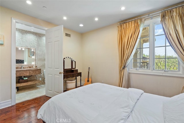 bedroom with dark wood-type flooring