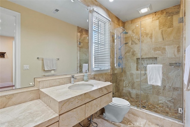 bathroom featuring walk in shower, vanity, toilet, and tile patterned floors