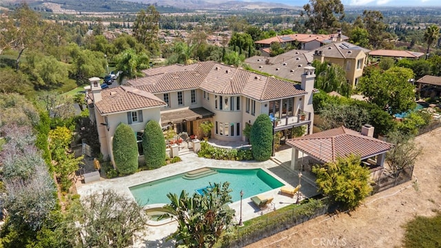 view of pool with a patio and a gazebo