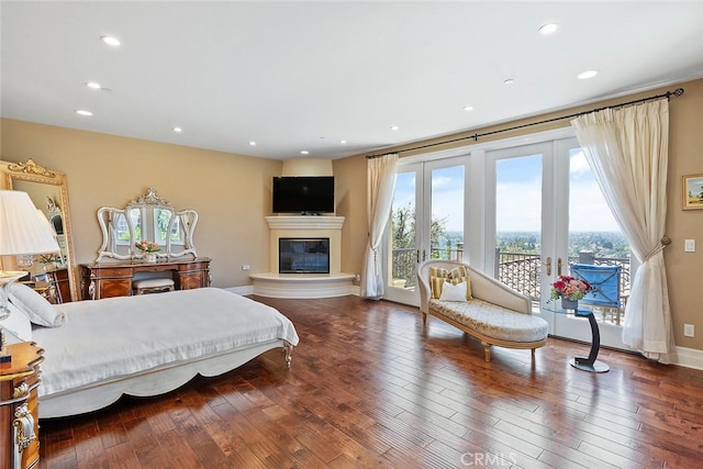 bedroom featuring french doors, hardwood / wood-style flooring, and access to exterior