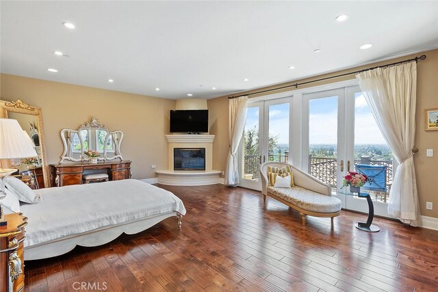 11755 Collar Ave, Tustin, CA 92782 - bedroom with access to exterior, wood-type flooring, a glass covered fireplace, recessed lighting, and french doors
