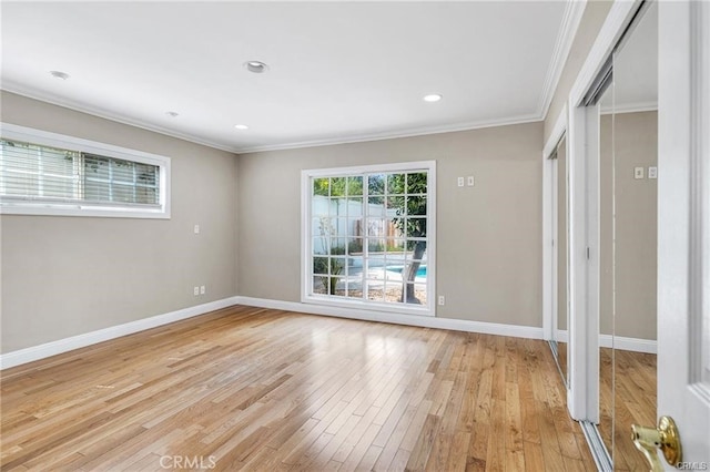 unfurnished room with light hardwood / wood-style floors and ornamental molding