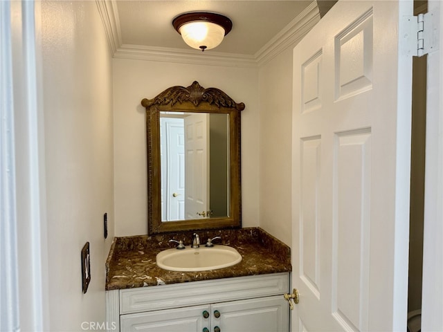 bathroom featuring crown molding and vanity