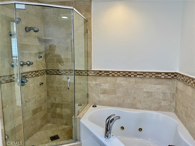 bathroom with separate shower and tub