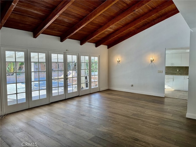 spare room featuring wood ceiling, wood-type flooring, french doors, and beamed ceiling