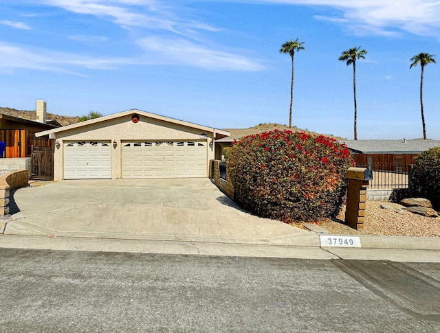 ranch-style house featuring a garage