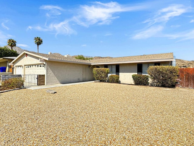 single story home featuring a garage