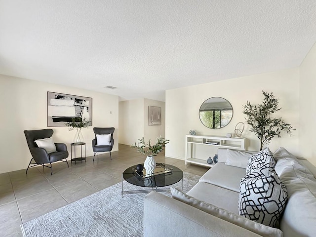 tiled living room with a textured ceiling