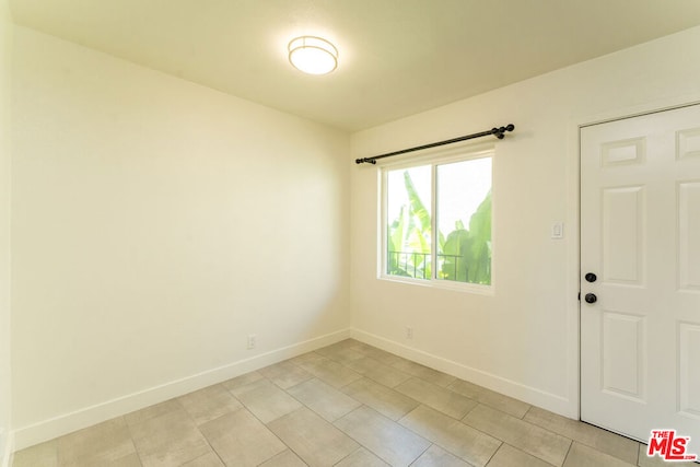 foyer with light tile patterned flooring