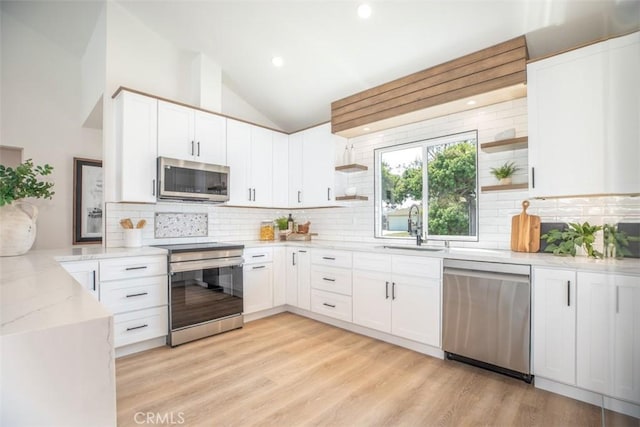 kitchen with white cabinetry and appliances with stainless steel finishes