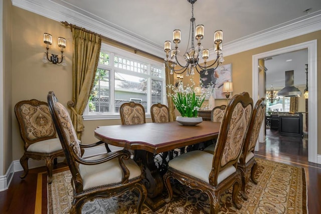 dining room featuring crown molding, hardwood / wood-style flooring, and a chandelier